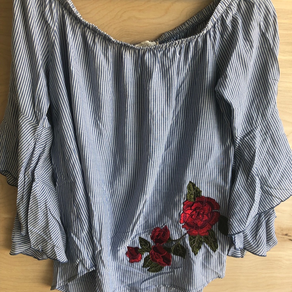 Off the shoulder shirt.